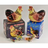 Tin plate - a retro Chinese battery operated Hen Laying Eggs model, another both with two eggs,