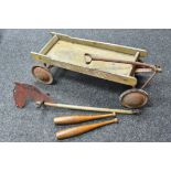 A mid 20th century child's pull-a-long cart, inscribed Air Flow,