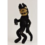 Felix The Cat - an early 20th century stuffed and wired poseable figure, black ans white body,