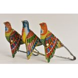 A set of three mechanical squeeze action tin plate bird calls, under wing bellows sound tubes,