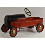 A vintage early 1950s Tri-ang Duke peddle car, red and black painted metal body,