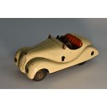 Schuco (Germany) a Pre-War Examico 4001 Clockwork Tinplate Car, cream body, red seats,