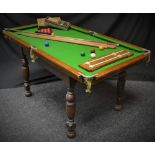 An E J Riley single piece slate bed snooker table, approx 5ft x 3ft,