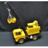 Toys and Juvenalia - a Tonka crane, the grabber bucket operated by a twin pulley system,