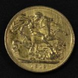 Coins - a George V gold sovereign,
