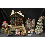 Christmas Decorations - a large light up musical three storey snow covered house;