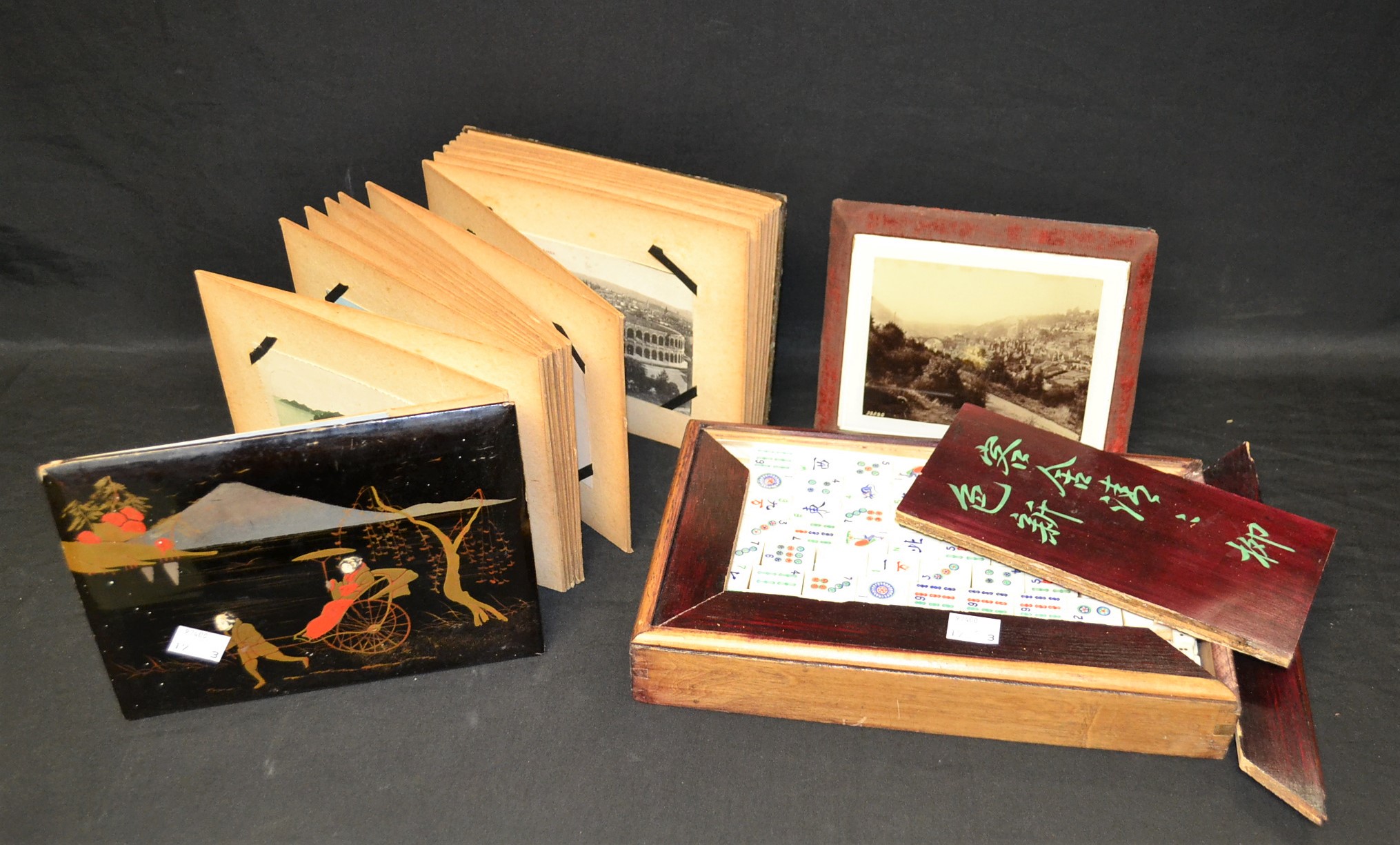 An early 20th century Japanese lacquered postcard album, with assorted contents,