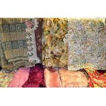 A large quantity of vintage textiles including printed linen curtains,