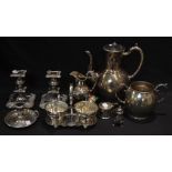 Silver Plate - a Victorian three piece tea set; a pair of single candlesticks;