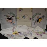 Textiles - hand embroidered linen tablecloths, including Crinoline Lady, English Country Flowers,