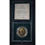 Coins - a Royal Mint Queen Elizabeth II United Kingdom BU gold five pound coin,