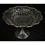 An Edwardian pedestal comport, the shaped circular bowl pierced with scrolling foliage, 24.