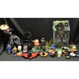 Halloween - a Haunted Mansion; a scarecrow figure; witch doll, cauldron, skeletons, ghosts,