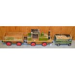 A vintage wooden toy train engine and tender;