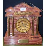 A 19th century French specimen marble architectural mantel clock, in the classical taste, 32cm high,