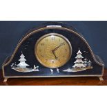 A black lacquer Chinese style mantel clock, inlaid with mother of pearl pagodas and figure,