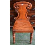 A Victorian carved oak hall chair