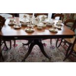 A post-Regency mahogany rounded rectangular breakfast table, moulded top above a deep beaded frieze,