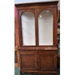 A 19th century mahogany library bookcase, moulded cornice above a pair of glazed doors,