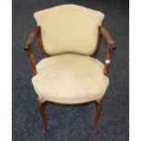 A 19th century rosewood elbow chair, in the French Hepplewhite taste, stuffed over upholstery,