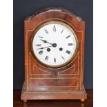 A Victorian mahogany inlaid bracket clock, Roman numerals, twin winding holes, 29.