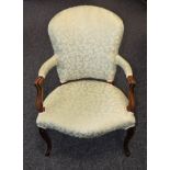 A French Hepplewhite mahogany elbow chair, stuffed over upholstery,