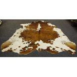 A cow hide rug,