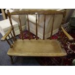 An oak spindle back cottage two seat settee