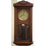 An early 20th century oak wall clock by Freidrich Mauthe Schwenningen c.