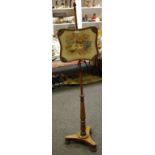 A Victorian rosewood pole screen, floral embroidered banner, turned column, triform base,