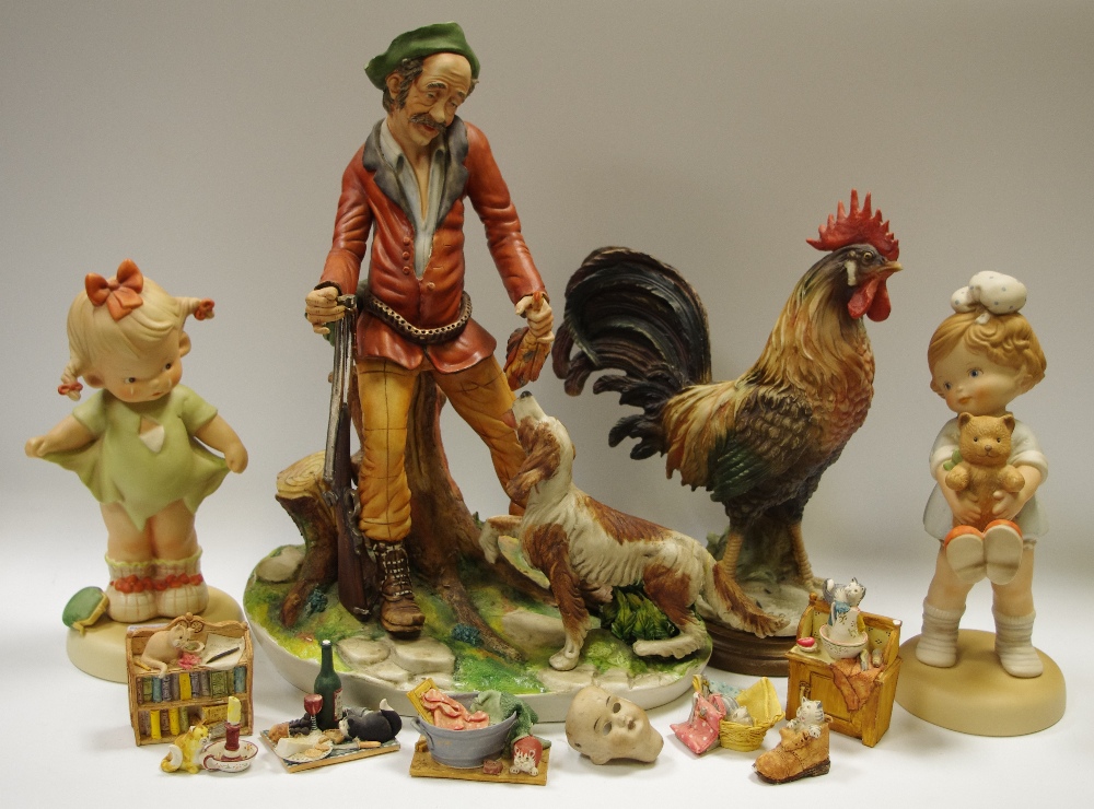 A large continental bisque porcelain figural group of the the huntsman with his dog,