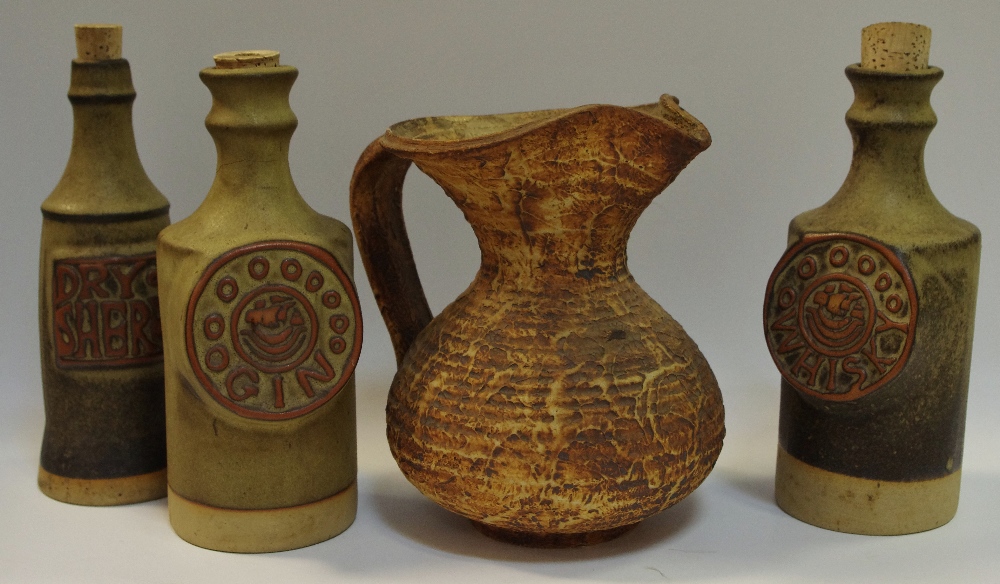 Studio Pottery - Cornwall - three Tremar Pottery flasks/decanters comprising gin,