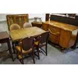 An oak drawer leaf table; four chairs; a Beautility sideboard;
