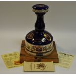 A Pusser's 'Battle of Trafalgar Bicentenary 1805-2005' ships decanter with a Victory oak decanter