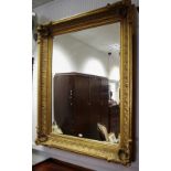 A large gilt framed wall mirror, bevel edge glass, acanthus moulding to frame,