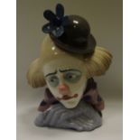 A Lladro porcelain figure of a contemplating clown,