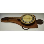 An early 20th century banjo mandolin and case