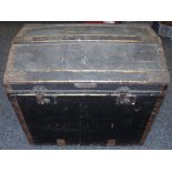 A canvas and wood bound dome top trunk Minshall Bengough label to interior