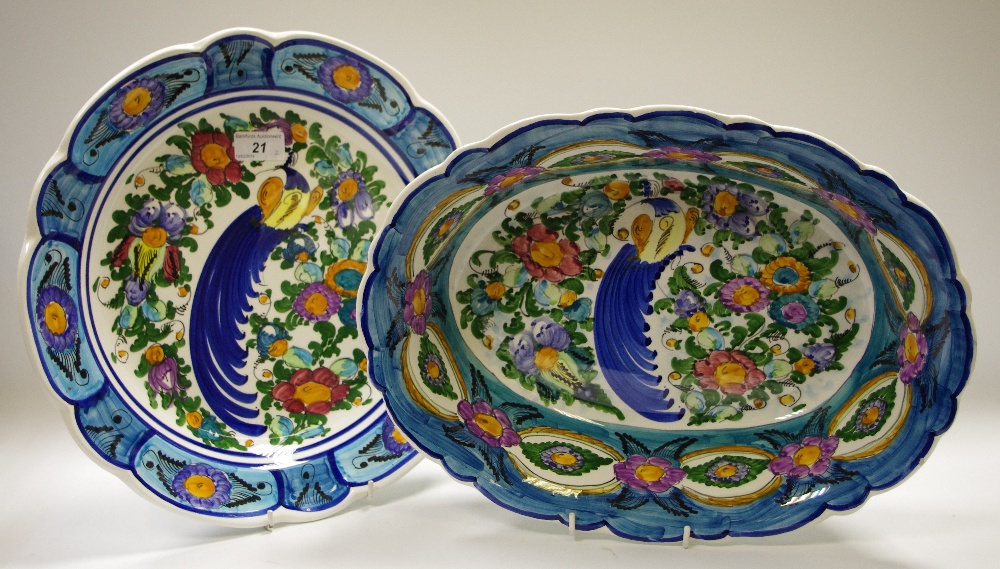 A large bowl and charger, decorated with fanciful bird and foliage,