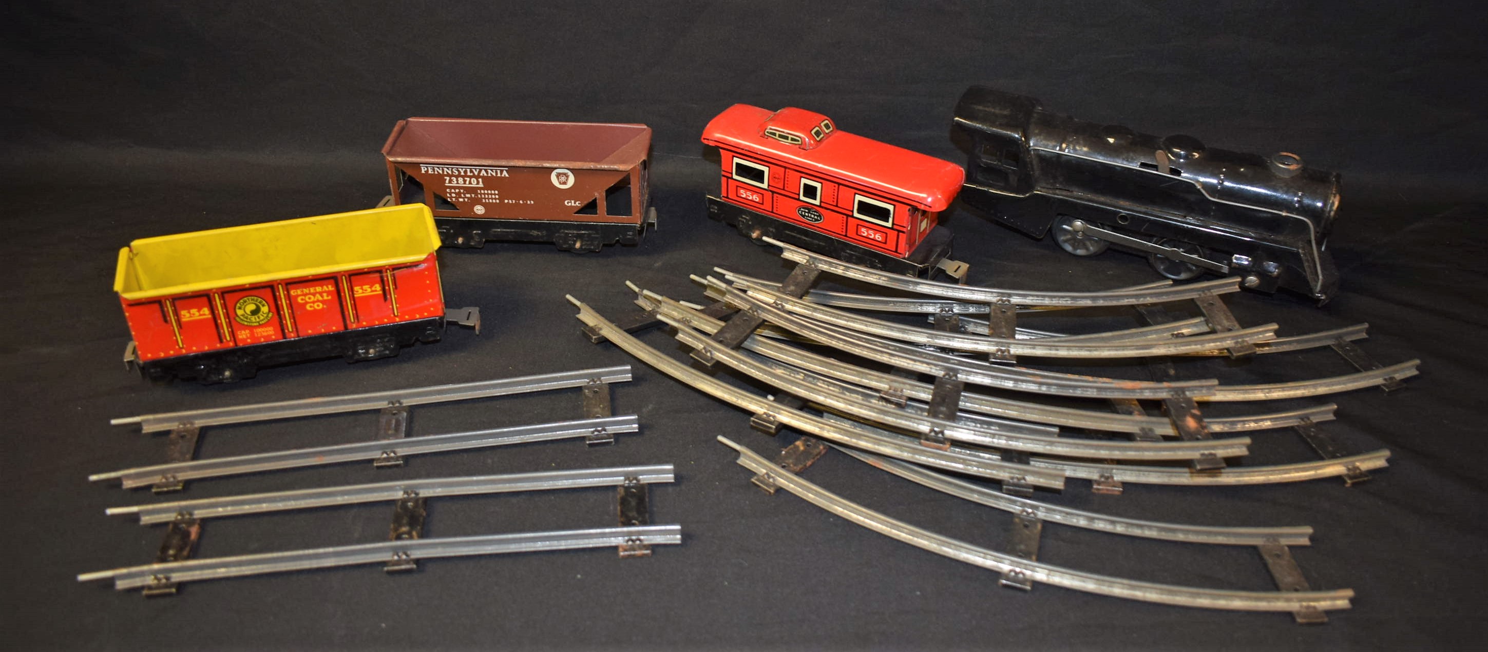 A Marx Toys clock work tin plate O gauge train set, 0-4-0 locomotive, black livery,