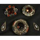 A large Scottish silver stone set brooch; two others,