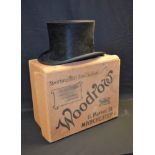 An early 20th century Christys' London, gentleman's black silk top hat; an advertising box, Woodrow,