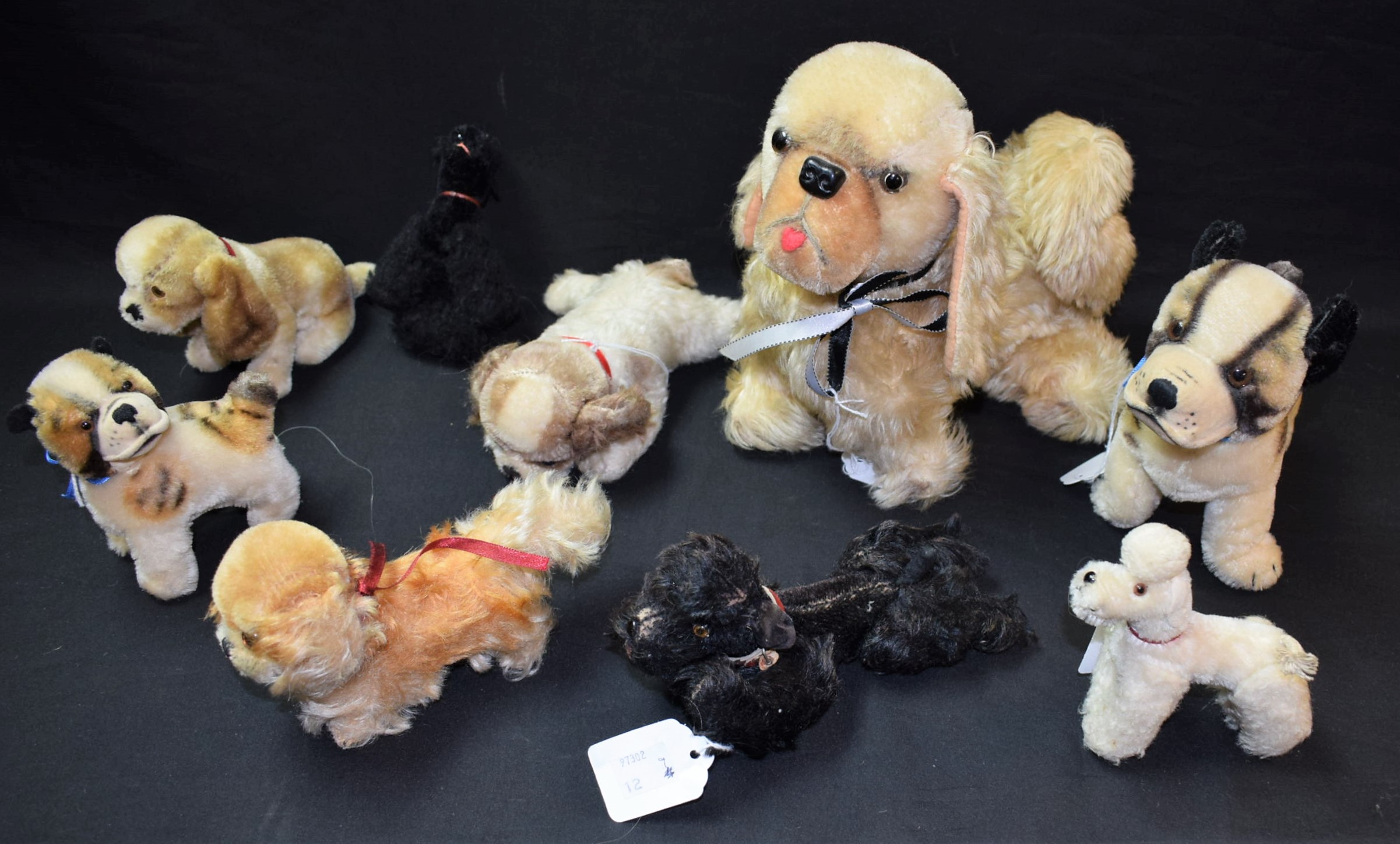 Stuffed Toys - a black Steiff Poodle, four articulated legs, glass eyes, remnants of paper label,
