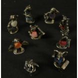 A set of nine novelty silver plated miniature animal pin cushions, as a musical band approx 3.