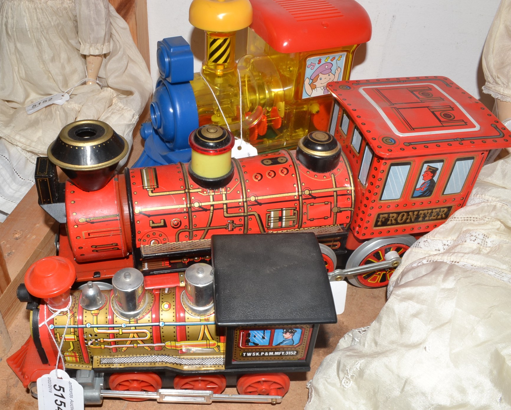 A Japanese Modern Toys Tin plate battery operated Frontier Train, red and black body,