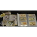 Two collector's albums of circulated and modern largely uncirculated bank notes from most countries