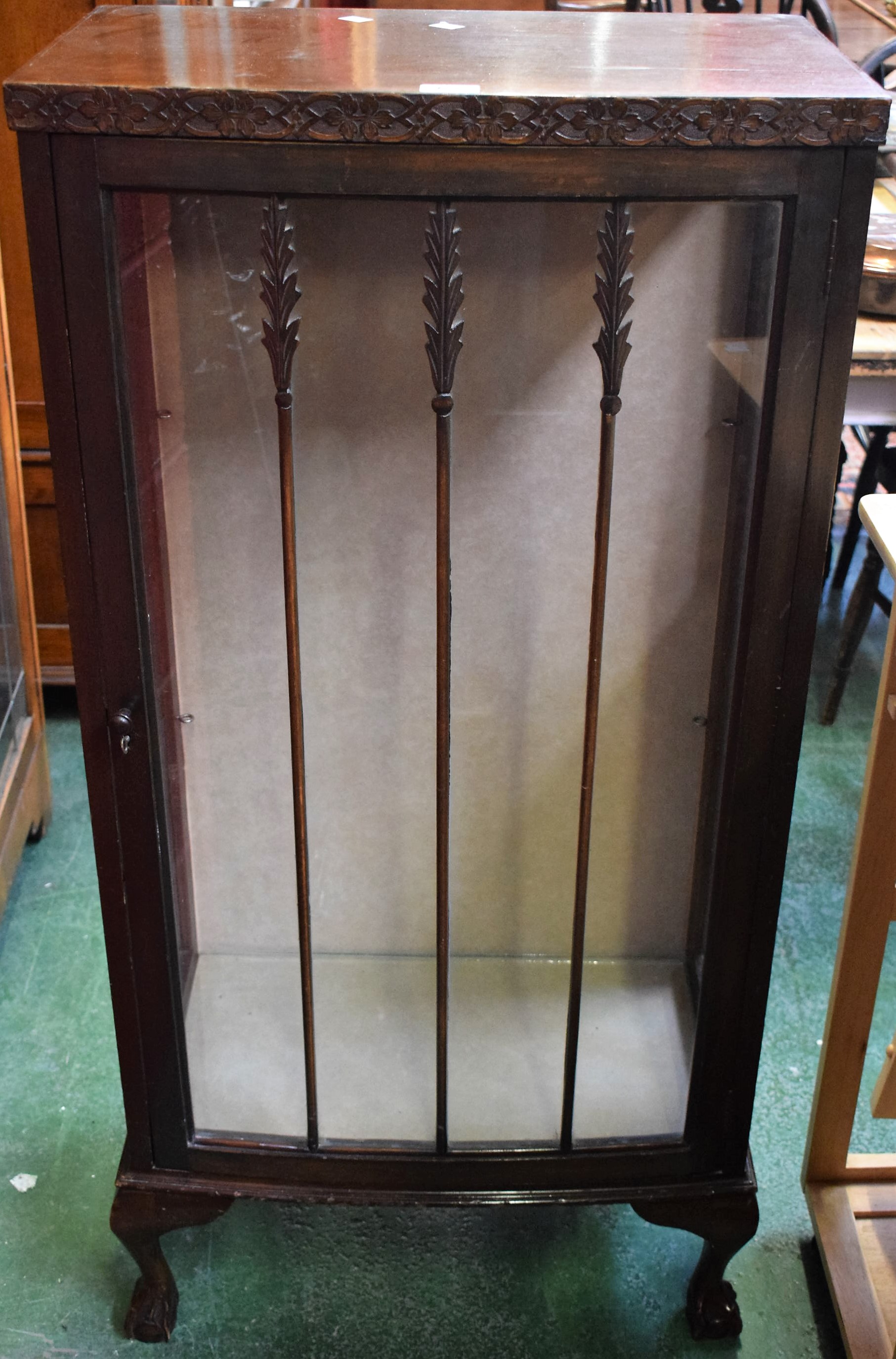 A 20th century mahogany display cabinet, ball and claw feet,