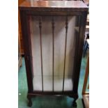 A 20th century mahogany display cabinet, ball and claw feet,