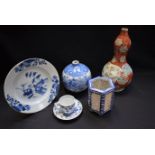 An 18th century Chinese blue and white plate; a Japanese Meiji double gourd vase,