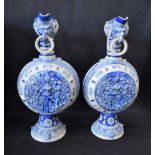 A pair of large 19th century German Westerwald type stoneware armorial jugs,